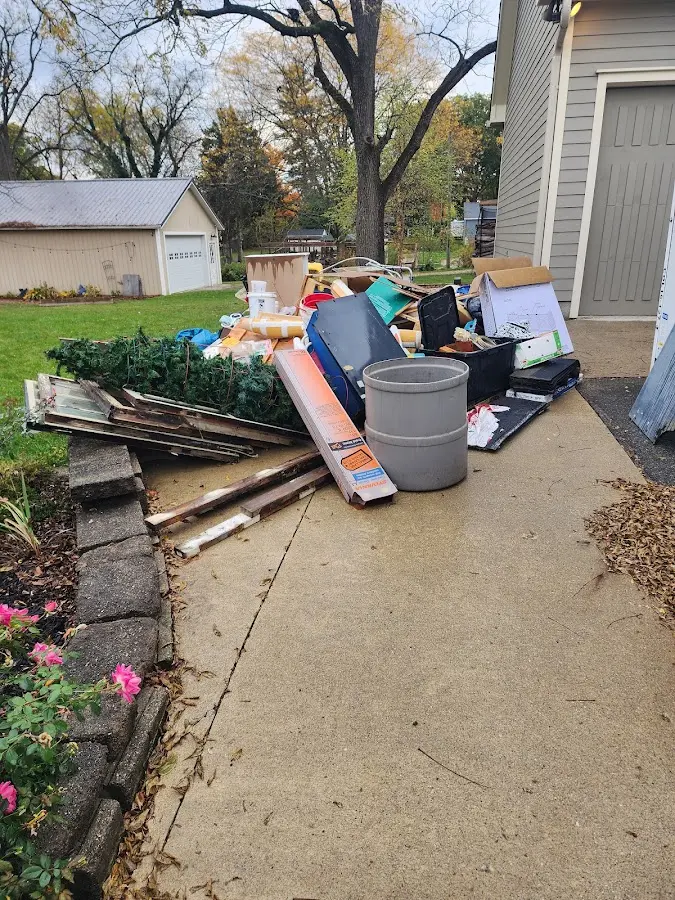 Dumpster being loaded with debris for 10 Yard Dumpster Rental in Point Baker